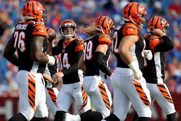 Cincinnati Bengals quarterback Andy Dalton (14} looks to the scoreboard after a stalled drive in the second quarter of a preseason game against the Buffalo Bills at New Era Stadium in Orchard Park, New York.  (Kareem Elgazzar / The Cincinnati Enquirer)